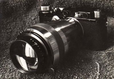a black and white photo of a camera on a cloth