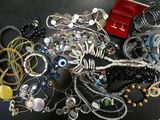 many different types of jewelry on the table