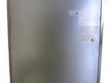 a silver refrigerator that is sitting on a white surface