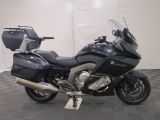 a picture of a black motorcycle parked in a garage