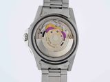 an image of a silver watch with a purple face on a white background