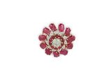 a close up of a red and white diamond flower broochle