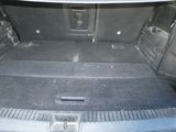 a trunk of a car with the back seats folded down