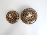 two brown and white plates on a white table