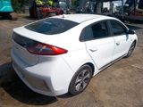 a white car that is parked in a lot