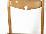 a wooden chair with a wooden seat on a white background