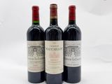 trois bouteilles de vin posées l'une à côté de l'autre sur une table
