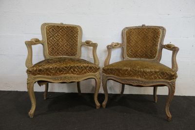 pair of antique chairs with upholstered upholstered arms