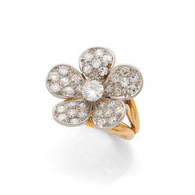 a diamond flower ring, by van cleef