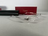 cartier eyeglasses with box and case on a table