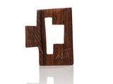 a small wooden object with a square cut out of it