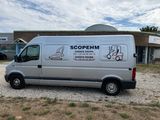 a silver van that is parked in front of a building