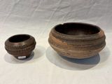 two bowls sitting next to each other on a table
