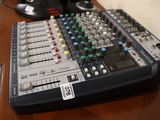 a sound board sitting on a table with a microphone