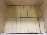 a cardboard box that has a bunch of books inside of it