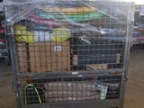 a metal cart with many items in it in a warehouse