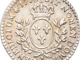 a close up of a coin with a crown on top of it