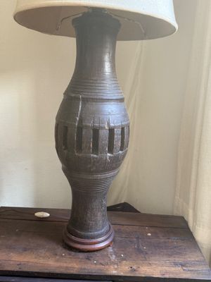 a lamp that is sitting on top of a wooden table