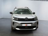 the front of a silver citrole parked in a garage