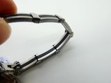 a person that is holding a watch in their hand