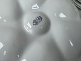 a white plate with a black and white design on it