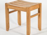 a wooden stool with a curved seat on a white background