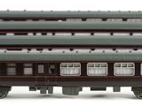 four train cars sitting next to each other on a white surface
