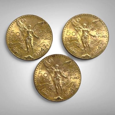 trois pièces d'or sur lesquelles figurent l'effigie d'un homme et d'une femme