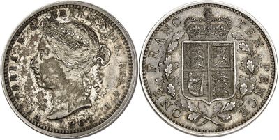 a close up of a silver coin with a crown on it