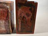these are two pieces of art that are sitting on a table