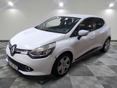 the white car is parked on a checkered floor in the garage