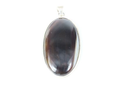 a close up of a pendant on a white background