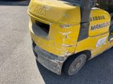 a yellow forklift truck parked in a parking lot