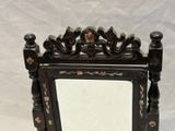a mirror that is sitting on a table