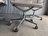two office chairs that are sitting in a room