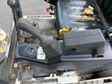 a close up of a car ' s engine with the seat down