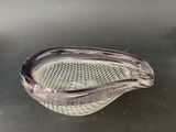 a glass bowl that is sitting on a table