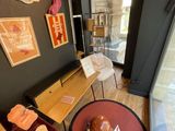an image of a coffee shop with a table and chairs
