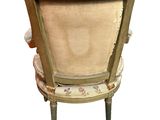 a chair that has a cushion on the back of it