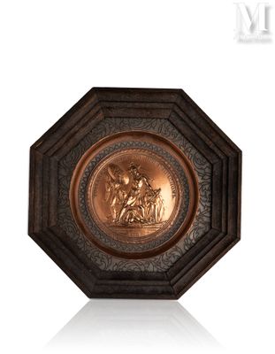 an antique bronze plaque depicting a man and woman on a horse