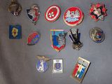 a lot of badges that are on a table
