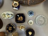 many different types of decorative objects displayed on the table