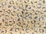 a floral pattern on the fabric of a bed
