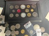 a lot of coins that are on the table