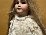 a doll that is sitting on a table in a room