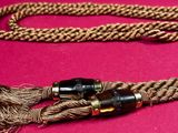 a close up of a rope with a microphone plug attached to it