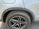 a close up of a car ' s tire on the road