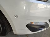 a close up of a car ' s front bumper with a hole in the bumper
