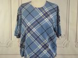 blue and white plaid shirt on a mannequin stand