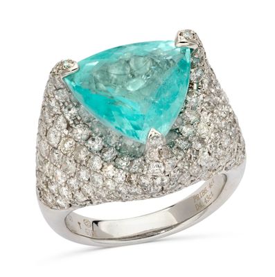 an image of a ring with a large green stone surrounded by white diamonds